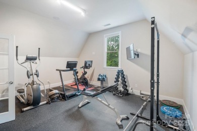 Situated on 1.64 acres w/golf course views, this home offers on Trump National Golf Club Charlotte in North Carolina - for sale on GolfHomes.com, golf home, golf lot