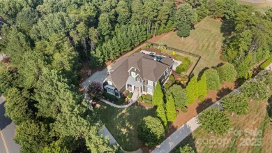 Situated on 1.64 acres w/golf course views, this home offers on Trump National Golf Club Charlotte in North Carolina - for sale on GolfHomes.com, golf home, golf lot