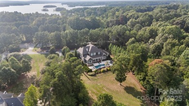 Situated on 1.64 acres w/golf course views, this home offers on Trump National Golf Club Charlotte in North Carolina - for sale on GolfHomes.com, golf home, golf lot
