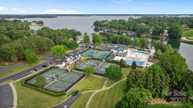 Situated on 1.64 acres w/golf course views, this home offers on Trump National Golf Club Charlotte in North Carolina - for sale on GolfHomes.com, golf home, golf lot