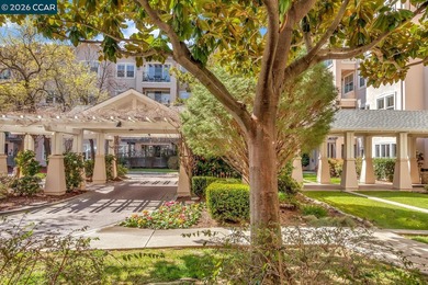 Sunny Waterford condo tucked among mature trees with a pleasant on Rossmoor Golf Course in California - for sale on GolfHomes.com, golf home, golf lot