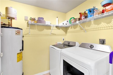 Enjoy stunning views of the aqua range and 9th fairway from this on Oak Harbor Country Club in Florida - for sale on GolfHomes.com, golf home, golf lot