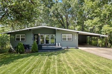 Beautiful remodeled home that backs up to the Tunnel Vision Bike on Bella Vista Country Club and Golf Course in Arkansas - for sale on GolfHomes.com, golf home, golf lot