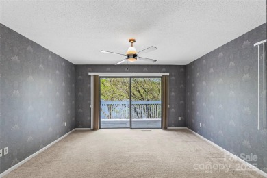LAKEFRONT LIVING AS IT'S FINEST! Nestled in serene natural on Connestee Falls Golf Club in North Carolina - for sale on GolfHomes.com, golf home, golf lot