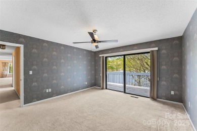 LAKEFRONT LIVING AS IT'S FINEST! Nestled in serene natural on Connestee Falls Golf Club in North Carolina - for sale on GolfHomes.com, golf home, golf lot