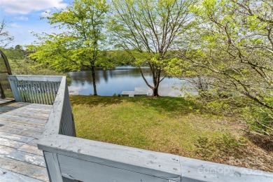 LAKEFRONT LIVING AS IT'S FINEST! Nestled in serene natural on Connestee Falls Golf Club in North Carolina - for sale on GolfHomes.com, golf home, golf lot
