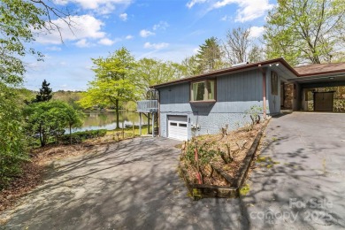 LAKEFRONT LIVING AS IT'S FINEST! Nestled in serene natural on Connestee Falls Golf Club in North Carolina - for sale on GolfHomes.com, golf home, golf lot
