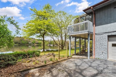 LAKEFRONT LIVING AS IT'S FINEST! Nestled in serene natural on Connestee Falls Golf Club in North Carolina - for sale on GolfHomes.com, golf home, golf lot
