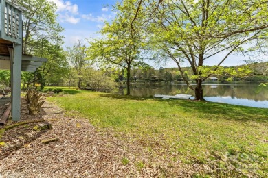 LAKEFRONT LIVING AS IT'S FINEST! Nestled in serene natural on Connestee Falls Golf Club in North Carolina - for sale on GolfHomes.com, golf home, golf lot