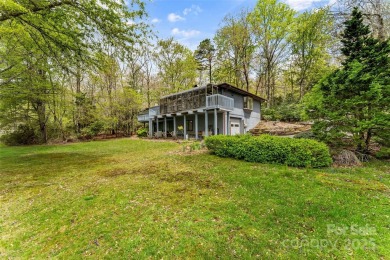 LAKEFRONT LIVING AS IT'S FINEST! Nestled in serene natural on Connestee Falls Golf Club in North Carolina - for sale on GolfHomes.com, golf home, golf lot