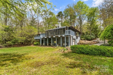 LAKEFRONT LIVING AS IT'S FINEST! Nestled in serene natural on Connestee Falls Golf Club in North Carolina - for sale on GolfHomes.com, golf home, golf lot