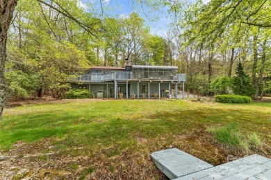 LAKEFRONT LIVING AS IT'S FINEST! Nestled in serene natural on Connestee Falls Golf Club in North Carolina - for sale on GolfHomes.com, golf home, golf lot