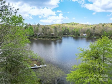 LAKEFRONT LIVING AS IT'S FINEST! Nestled in serene natural on Connestee Falls Golf Club in North Carolina - for sale on GolfHomes.com, golf home, golf lot