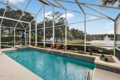 LAKEFRONT fountain views set the tone for this exceptional POOL on Plantation Bay Golf and Country Club in Florida - for sale on GolfHomes.com, golf home, golf lot
