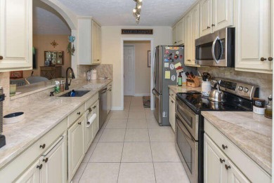 This charming home sits pretty on an oversized lot with stunning on Eagle Wood Golf Course in Florida - for sale on GolfHomes.com, golf home, golf lot