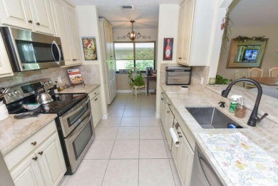This charming home sits pretty on an oversized lot with stunning on Eagle Wood Golf Course in Florida - for sale on GolfHomes.com, golf home, golf lot