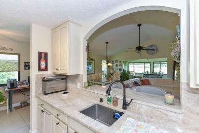 This charming home sits pretty on an oversized lot with stunning on Eagle Wood Golf Course in Florida - for sale on GolfHomes.com, golf home, golf lot
