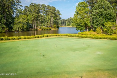 Don't miss this .47 acre wooded golf course lot overlooking the on Cypress Landing Golf Club in North Carolina - for sale on GolfHomes.com, golf home, golf lot