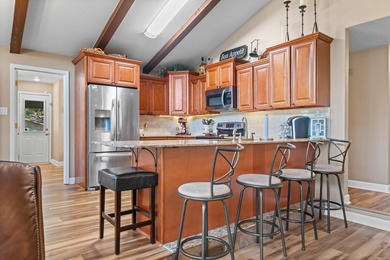 Full of personality and charm, this Diamondhead 2 bed 2.5 bath on Diamondhead Golf and Country Club in Arkansas - for sale on GolfHomes.com, golf home, golf lot