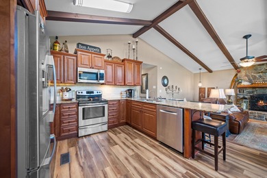 Full of personality and charm, this Diamondhead 2 bed 2.5 bath on Diamondhead Golf and Country Club in Arkansas - for sale on GolfHomes.com, golf home, golf lot