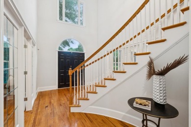 This distinguished two-story brick residence offers four on Dunes West Golf Club in South Carolina - for sale on GolfHomes.com, golf home, golf lot