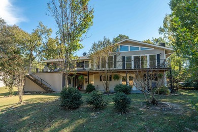 Full of personality and charm, this Diamondhead 2 bed 2.5 bath on Diamondhead Golf and Country Club in Arkansas - for sale on GolfHomes.com, golf home, golf lot