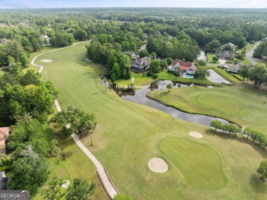 Nestled on a picturesque half-acre lot on the desirable Oak on Oak Grove Island Golf and Country Club in Georgia - for sale on GolfHomes.com, golf home, golf lot