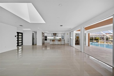 PUNTA GORDA ISLES! STUNNING MODERN 4 BEDROOM PLUS OFFICE, 3.5 on Saint Andrews South Golf Club in Florida - for sale on GolfHomes.com, golf home, golf lot