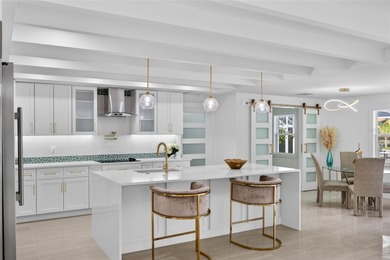 PUNTA GORDA ISLES! STUNNING MODERN 4 BEDROOM PLUS OFFICE, 3.5 on Saint Andrews South Golf Club in Florida - for sale on GolfHomes.com, golf home, golf lot