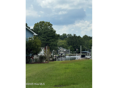 Bringing a touch of coastal charm to the highly sought-after on River Bend Golf and Country Club in North Carolina - for sale on GolfHomes.com, golf home, golf lot