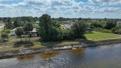 Location! Location! This is a .28 acre lot across the canal from on Mirror Lakes Golf Club in Florida - for sale on GolfHomes.com, golf home, golf lot