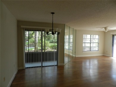 Freshly painted 2 bedroom, 2 bath ground floor end unit with1 on Innisbrook Resort and Golf Club in Florida - for sale on GolfHomes.com, golf home, golf lot