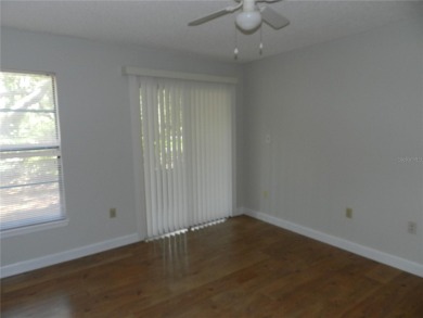Freshly painted 2 bedroom, 2 bath ground floor end unit with1 on Innisbrook Resort and Golf Club in Florida - for sale on GolfHomes.com, golf home, golf lot