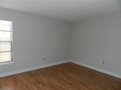 Freshly painted 2 bedroom, 2 bath ground floor end unit with1 on Innisbrook Resort and Golf Club in Florida - for sale on GolfHomes.com, golf home, golf lot