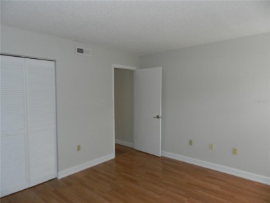 Freshly painted 2 bedroom, 2 bath ground floor end unit with1 on Innisbrook Resort and Golf Club in Florida - for sale on GolfHomes.com, golf home, golf lot