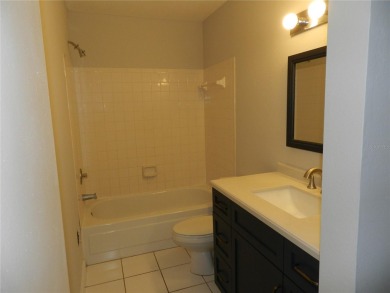 Freshly painted 2 bedroom, 2 bath ground floor end unit with1 on Innisbrook Resort and Golf Club in Florida - for sale on GolfHomes.com, golf home, golf lot