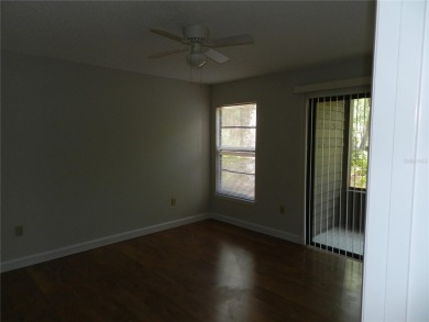 Freshly painted 2 bedroom, 2 bath ground floor end unit with1 on Innisbrook Resort and Golf Club in Florida - for sale on GolfHomes.com, golf home, golf lot