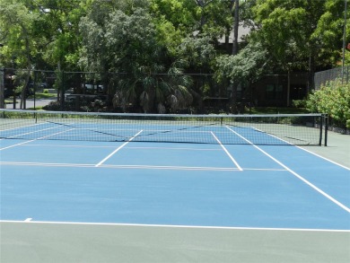 Freshly painted 2 bedroom, 2 bath ground floor end unit with1 on Innisbrook Resort and Golf Club in Florida - for sale on GolfHomes.com, golf home, golf lot