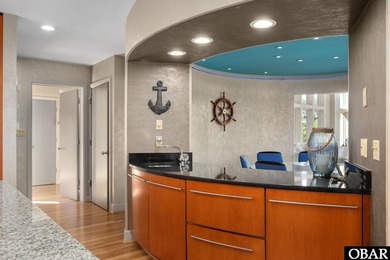 Bold in design and unmistakable in presence, this custom-built on The Currituck Golf Club in North Carolina - for sale on GolfHomes.com, golf home, golf lot