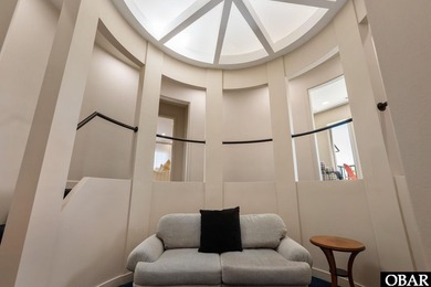 Bold in design and unmistakable in presence, this custom-built on The Currituck Golf Club in North Carolina - for sale on GolfHomes.com, golf home, golf lot