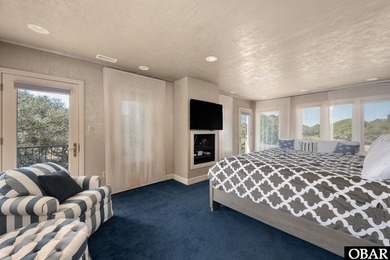 Bold in design and unmistakable in presence, this custom-built on The Currituck Golf Club in North Carolina - for sale on GolfHomes.com, golf home, golf lot