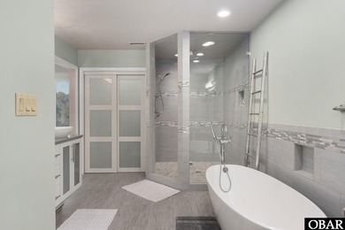 Bold in design and unmistakable in presence, this custom-built on The Currituck Golf Club in North Carolina - for sale on GolfHomes.com, golf home, golf lot