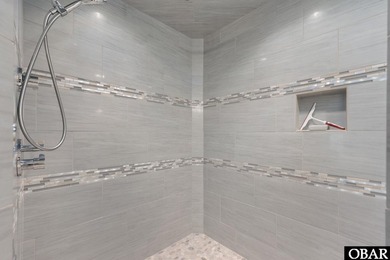 Bold in design and unmistakable in presence, this custom-built on The Currituck Golf Club in North Carolina - for sale on GolfHomes.com, golf home, golf lot