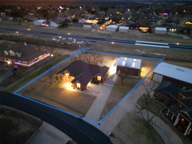 Rate takeoffs and landings from your back patio!  This lovely on Pecan Plantation Country Club in Texas - for sale on GolfHomes.com, golf home, golf lot