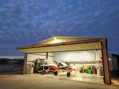 Rate takeoffs and landings from your back patio!  This lovely on Pecan Plantation Country Club in Texas - for sale on GolfHomes.com, golf home, golf lot