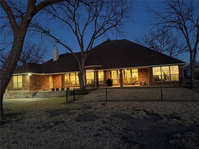 Rate takeoffs and landings from your back patio!  This lovely on Pecan Plantation Country Club in Texas - for sale on GolfHomes.com, golf home, golf lot