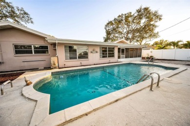 See this stately 4-bedroom, 3-bath home in the highly on The Dunedin Country Club in Florida - for sale on GolfHomes.com, golf home, golf lot