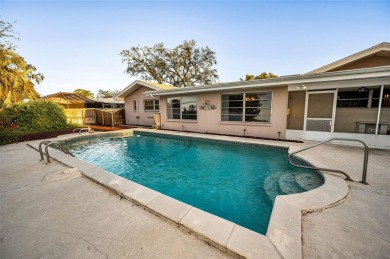 See this stately 4-bedroom, 3-bath home in the highly on The Dunedin Country Club in Florida - for sale on GolfHomes.com, golf home, golf lot