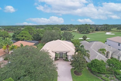 STUNNING POOL HOME WITH SWEEPING GOLF COURSE VIEW IN PGA on PGA Golf Club in PGA Village in Florida - for sale on GolfHomes.com, golf home, golf lot