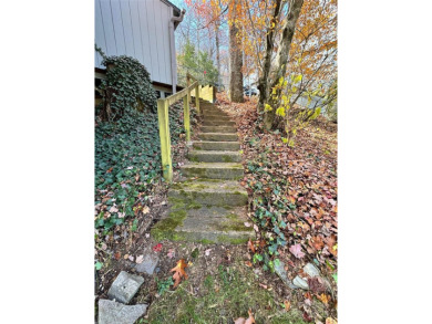 Walk to Roaring Fork Falls, the South Toe River and trails. This on Mt. Mitchell Golf Course in North Carolina - for sale on GolfHomes.com, golf home, golf lot